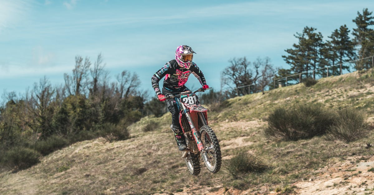 In kleptocats, what is the mighty alien race that the collectible refers to? - Motorcyclist during Motorcross race