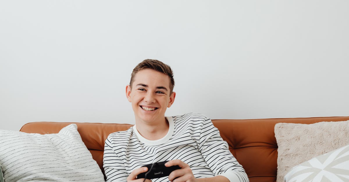 In Skyrim, how do I move the console command list? - Smiling Guy Relaxing at Home Playing Console