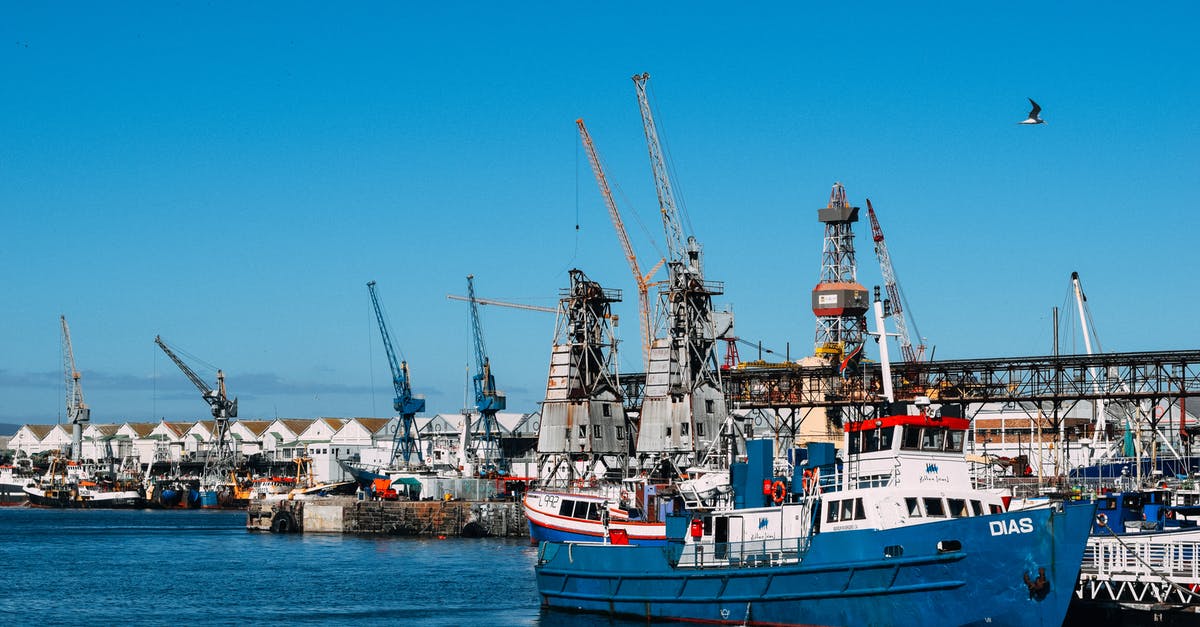 In skyrim, where can I find a ship that is insanely loaded with wine? - Industrial dock with contemporary cranes and moored cargo vessels in blue water in sunlight In skyrim, where can I find a ship that is insanely loaded with wine? - Industrial dock with contemporary cranes and moored cargo vessels in blue water in sunlight