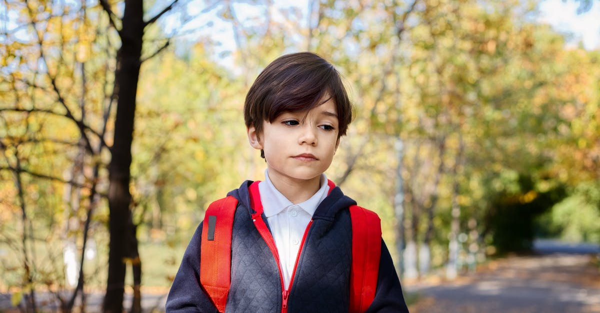 In Smite, how do I address the problem of jungling/ganking in Joust 3v3s? - Pensive little boy in school uniform with red backpack looking down while standing in autumn park after studies In Smite, how do I address the problem of jungling/ganking in Joust 3v3s? - Pensive little boy in school uniform with red backpack looking down while standing in autumn park after studies