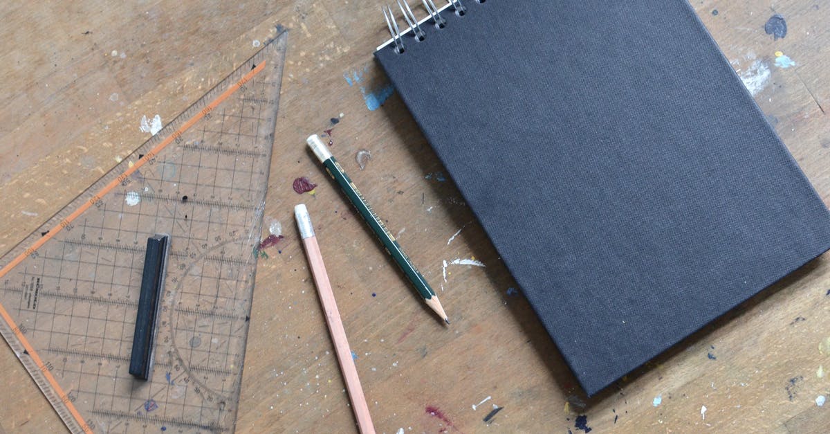 in tales of symphonia how do i open the black chests - Top view of empty opened notebook with black sheets and pencils near triangular ruler placed on shabby wooden table with paint spots