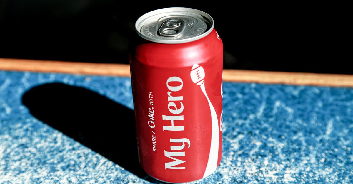 In WoW, how can I (via native features or add-ons) toggle between multiple spell bar configurations? - From above of red metal can with refreshing fizzing coke placed on table in cafe
