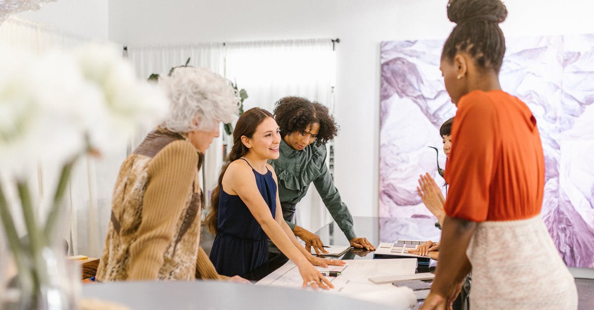 Increase RCI demand - A Group of Women Having Conversation Inside the Office