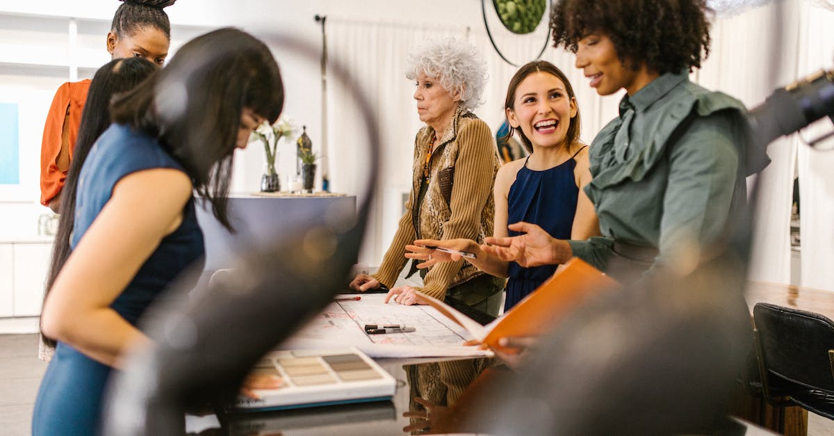 Increase RCI demand - A Group of Women Discussing About Business