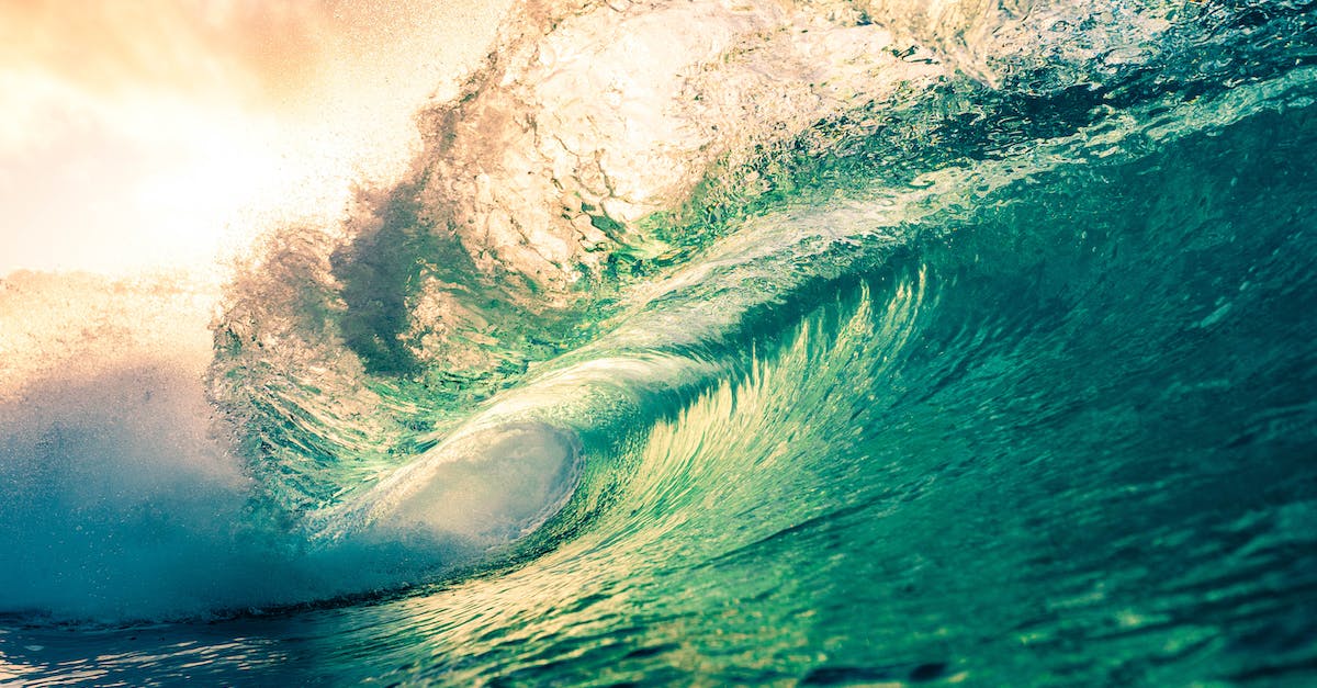 Infinite food, water and power - Amazing scenery of azure splashing waves rolling on rippling sea surface beneath light pink sunny sky Infinite food, water and power - Amazing scenery of azure splashing waves rolling on rippling sea surface beneath light pink sunny sky