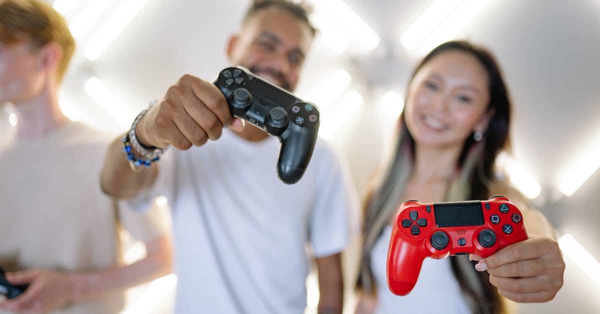 Installed games showing as not installed - Man and Woman Holding Black and Red Gaming Controller