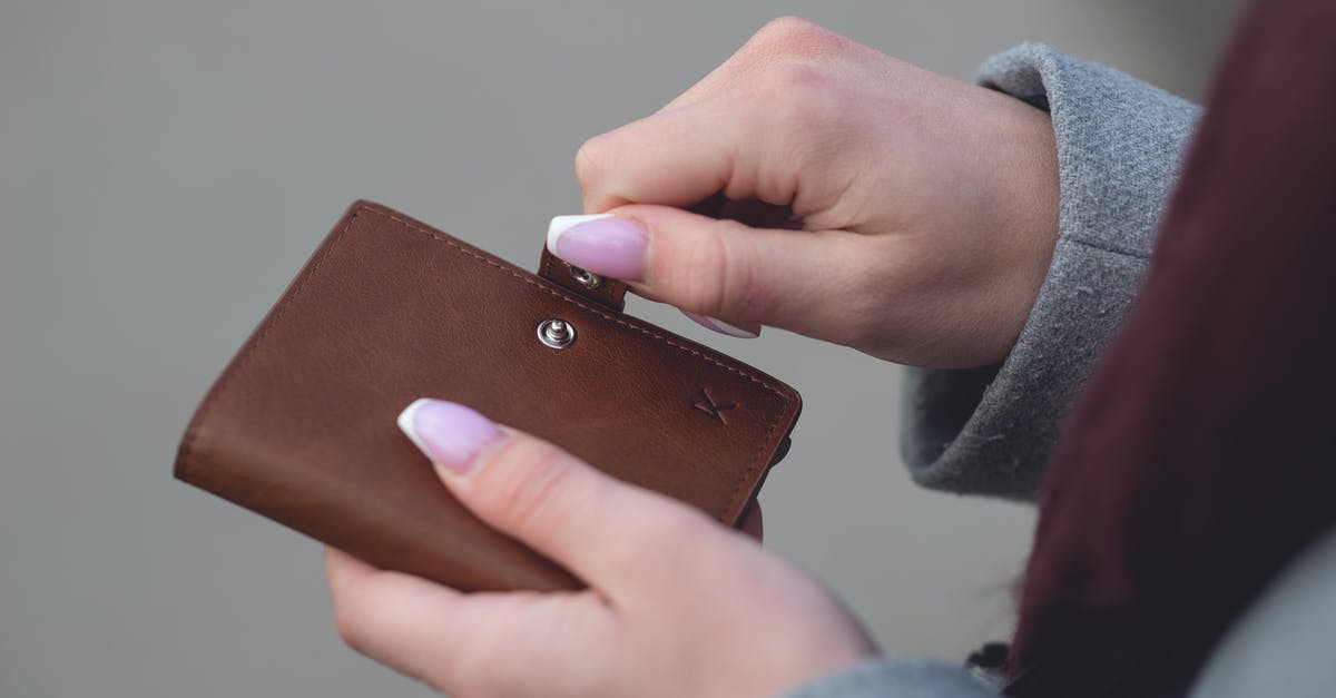 Inventory opening and closing - Person Closing a Brown Leather Wallet