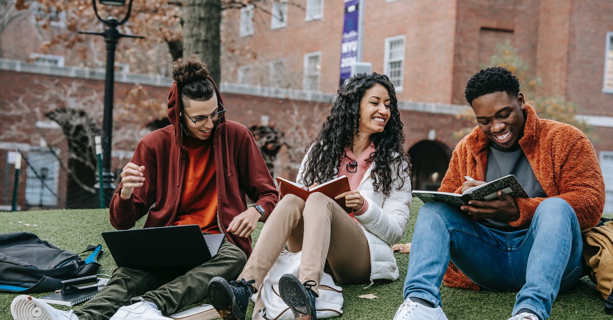 Inviting my friend to my minecraft pc singleplayer world [duplicate] - Full body of happy diverse students with notebooks and laptop sitting on grassy lawn on campus of university while studying together
