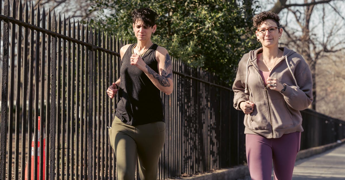 Is a Immolation only challenge run possible? - Adult sportswomen jogging together on street Is a Immolation only challenge run possible? - Adult sportswomen jogging together on street