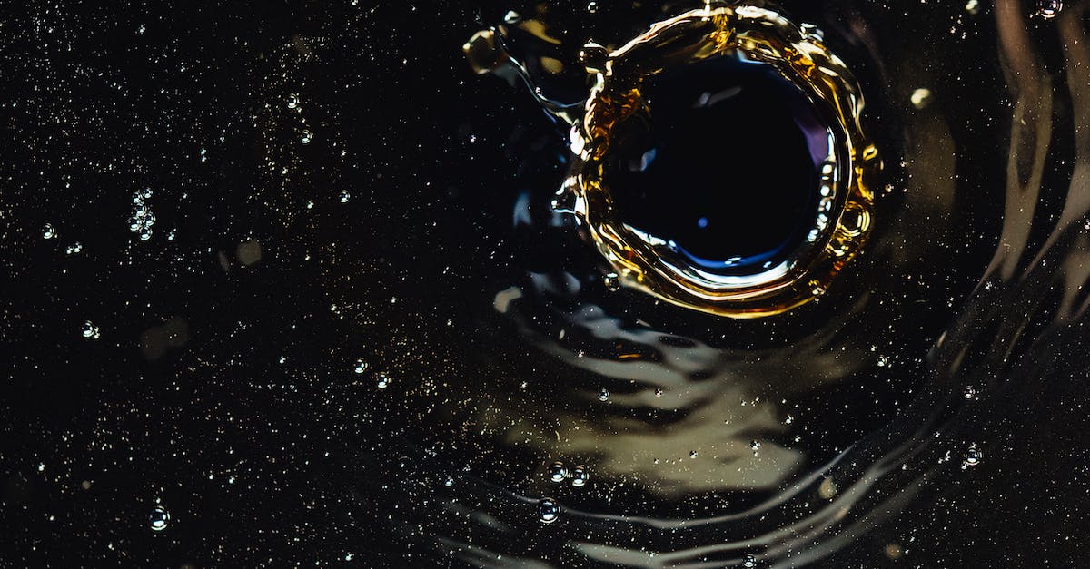 Is accuracy, recoil or bullet spread affected by enemy hits? - Droplet creating splash in dark liquid
