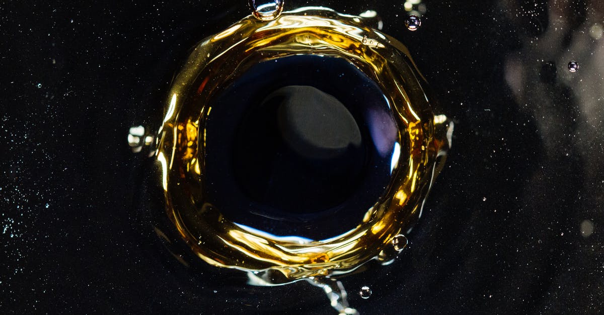 Is accuracy, recoil or bullet spread affected by enemy hits? - Closeup of droplet hitting surface of dark liquid and creating round shaped swirl and splashes as background