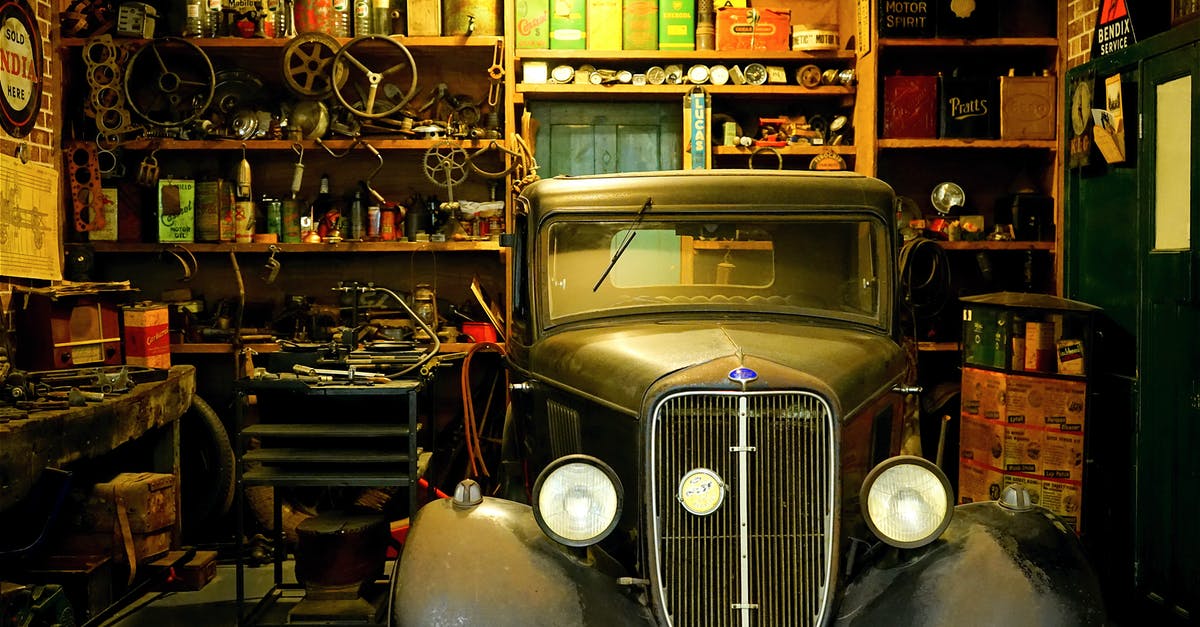 Is auto-scrapping by the workbench a good idea? - Black Classic Car Inside the Garage