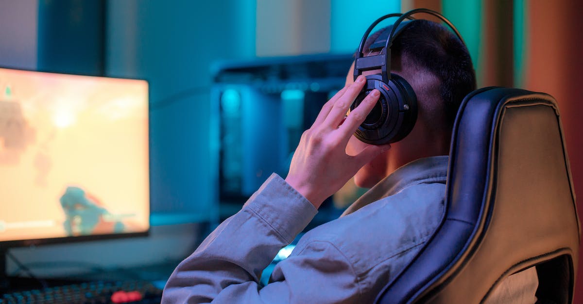 Is Bluetooth (headphones) efficient for gaming? - Man in Gray Dress Shirt Using Black Dslr Camera Is Bluetooth (headphones) efficient for gaming? - Man in Gray Dress Shirt Using Black Dslr Camera