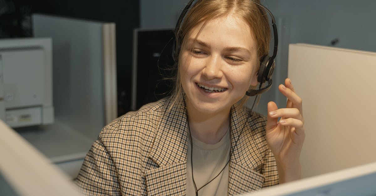 Is Call of Duty: Ghosts backwards compatible? - Woman in Brown and White Plaid Blazer Wearing Black Headphones