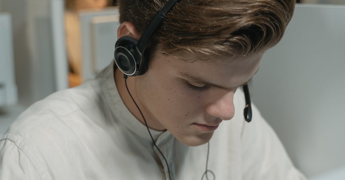 Is Call of Duty: Ghosts backwards compatible? - Man in White Crew Neck Shirt Wearing Black Headphones