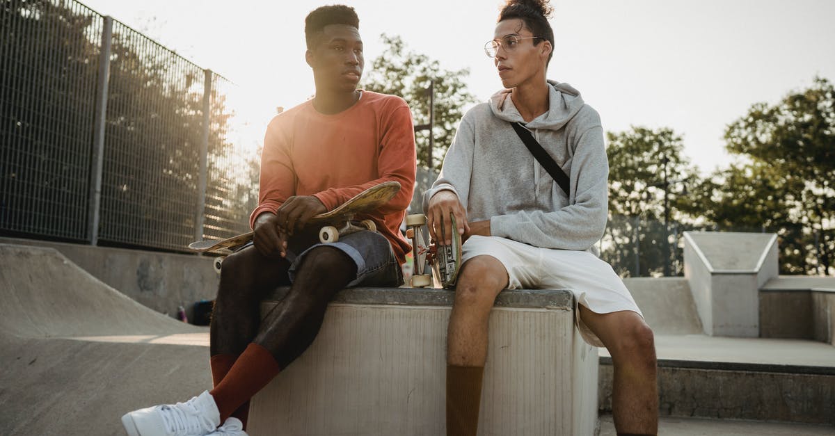 Is Clash cross platform multiplayer without account transfer? - Diverse skateboarders talking on skate ramp in evening