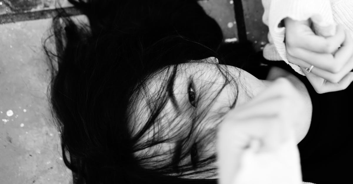 Is Defense cumulative or individual? - Overhead of black and white dark haired female showing fists while lying on tiled pavement and looking at camera Is Defense cumulative or individual? - Overhead of black and white dark haired female showing fists while lying on tiled pavement and looking at camera