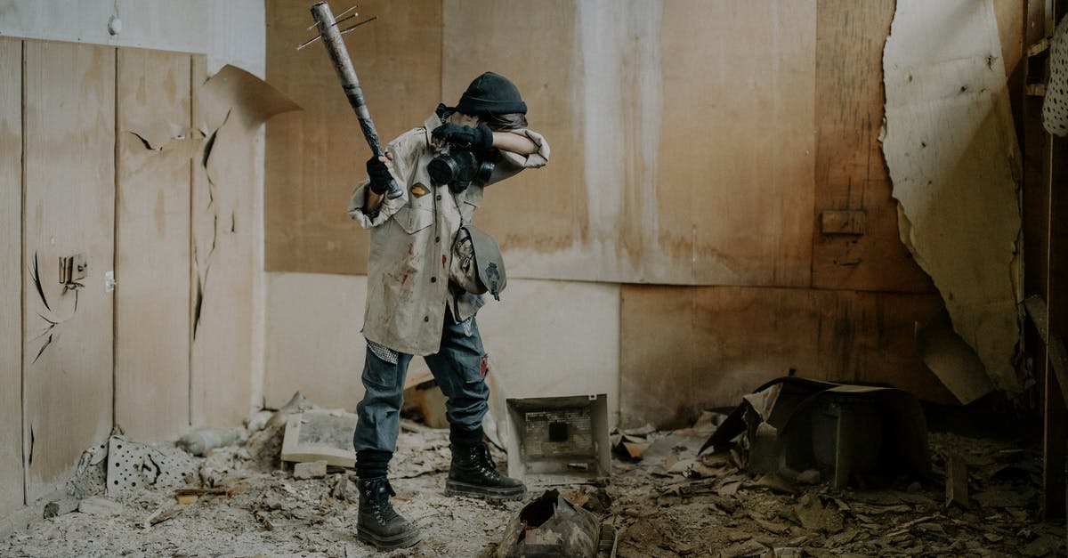 Is Defense Damage Reduction? - Man in Black and White Camouflage Uniform Holding Rifle Is Defense Damage Reduction? - Man in Black and White Camouflage Uniform Holding Rifle