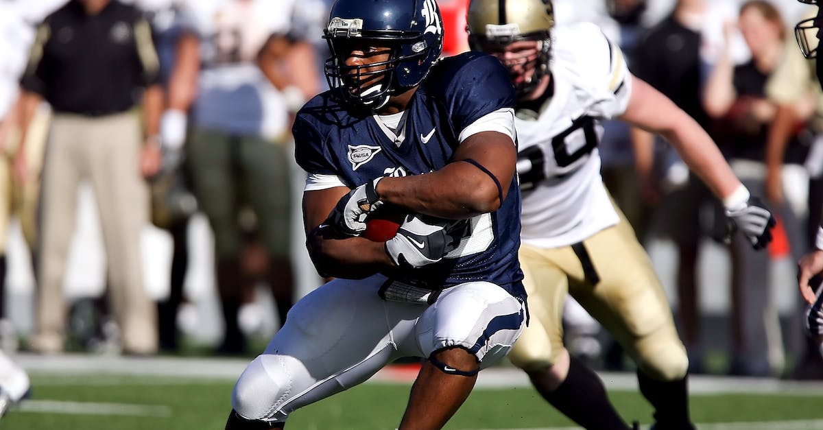 Is Defense the best offense in Clash of Clans - Football Player Hugging Ball While Opponent Chasing