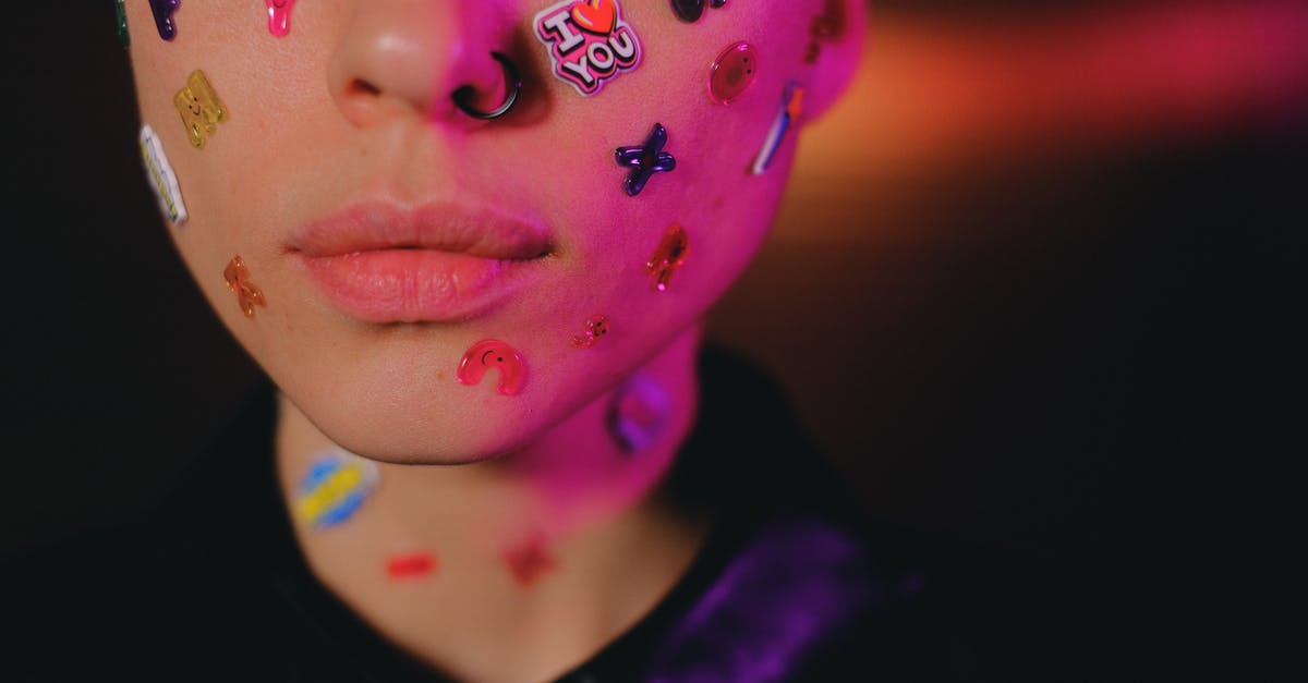 Is Farmville: On the Farm identical to the original Farmville? - Crop woman with multicolored stickers on face in dark studio Is Farmville: On the Farm identical to the original Farmville? - Crop woman with multicolored stickers on face in dark studio