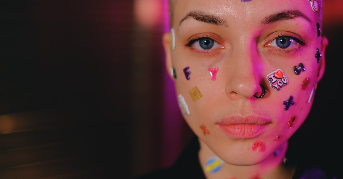 Is Farmville: On the Farm identical to the original Farmville? - Crop unemotional woman with stickers on face in dark studio Is Farmville: On the Farm identical to the original Farmville? - Crop unemotional woman with stickers on face in dark studio