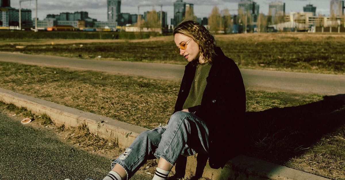 Is it always possible to eliminate all Geopanels? - Woman in Black Long Sleeve Shirt and Blue Denim Jeans Sitting on Brown Concrete Bench during Is it always possible to eliminate all Geopanels? - Woman in Black Long Sleeve Shirt and Blue Denim Jeans Sitting on Brown Concrete Bench during