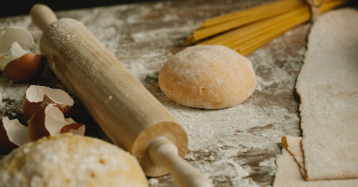 Is it beneficial to layer lures on overlapping pokestops? [duplicate] - Uncooked balls of dough near rolling pin placed on wooden table sprinkled with flour with eggshell and raw spaghetti in kitchen