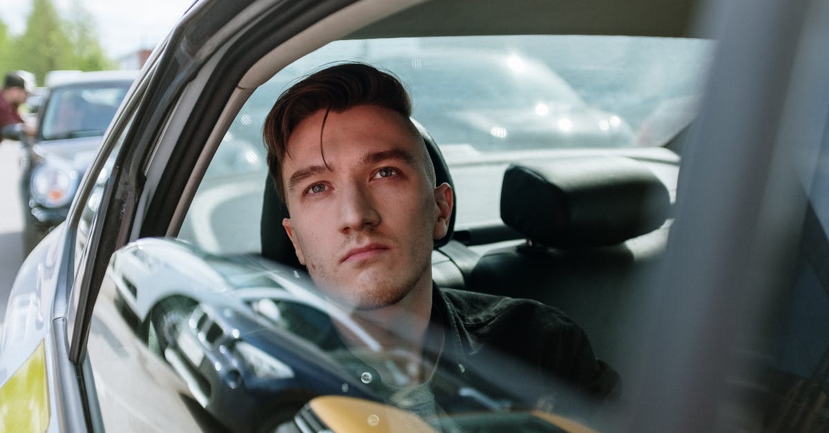 Is it considered cheating if one plays Pokémon GO while being a passenger in someone’s car? - Man in Green Jacket Driving Car Is it considered cheating if one plays Pokémon GO while being a passenger in someone’s car? - Man in Green Jacket Driving Car
