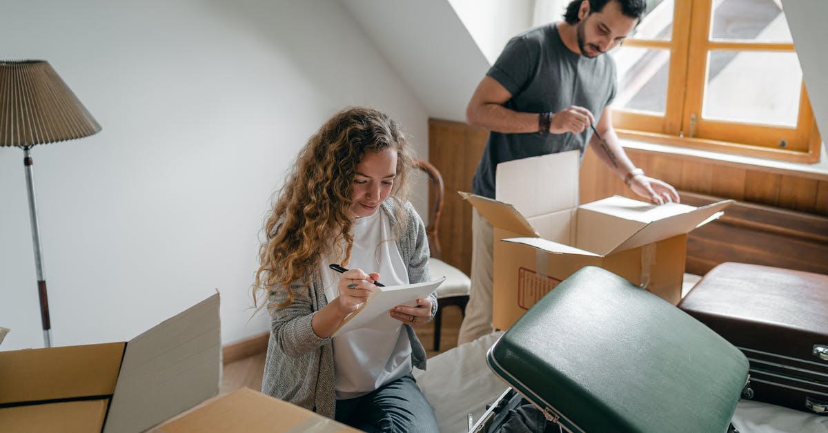 Is it necessary to start a new game after installing DLC? - Couple packing belongings into suitcases and carton boxes