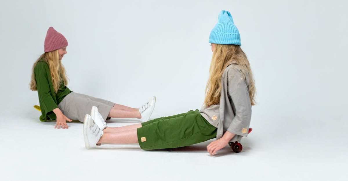 Is it possible for dwellers to have twins in fallout shelter? - Woman in Green Jacket and Blue Knit Cap Sitting on White Floor Is it possible for dwellers to have twins in fallout shelter? - Woman in Green Jacket and Blue Knit Cap Sitting on White Floor