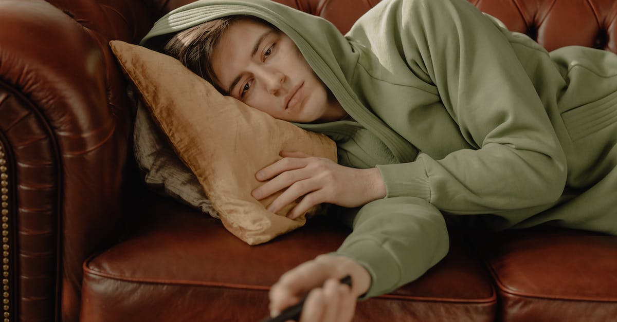Is it possible for MinecraftLauncher console to stay? - Woman in Gray Hoodie Lying on Brown Leather Couch Is it possible for MinecraftLauncher console to stay? - Woman in Gray Hoodie Lying on Brown Leather Couch