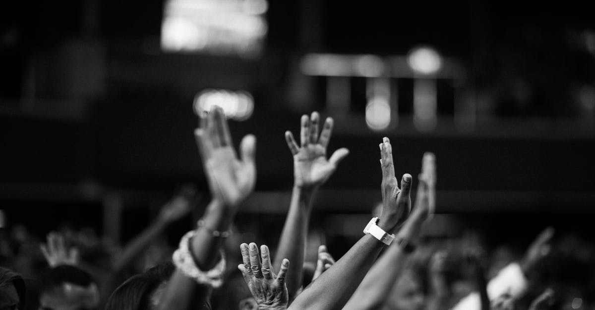 Is it possible for opposite-gendered Pokemon to show up in a chain? - Grayscale Photography of People Raising Hands