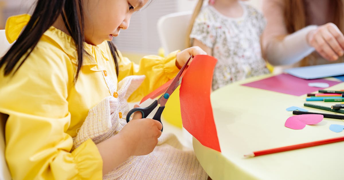 Is it possible to activate and play Mortal Kombat X in Germany? [closed] - Little Girl in Yellow Dress Cutting A Colored Paper 