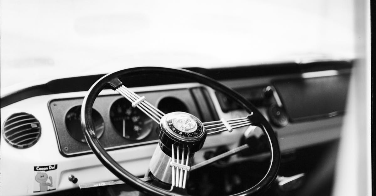 Is it possible to auto-squelch opponents? - Grayscale Photo of Car Steering Wheel