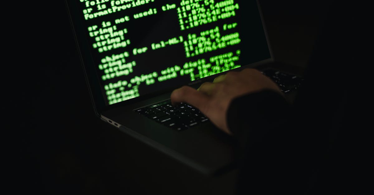 Is it possible to be immune to dark attacks? - Crop hacker typing on laptop with information on screen