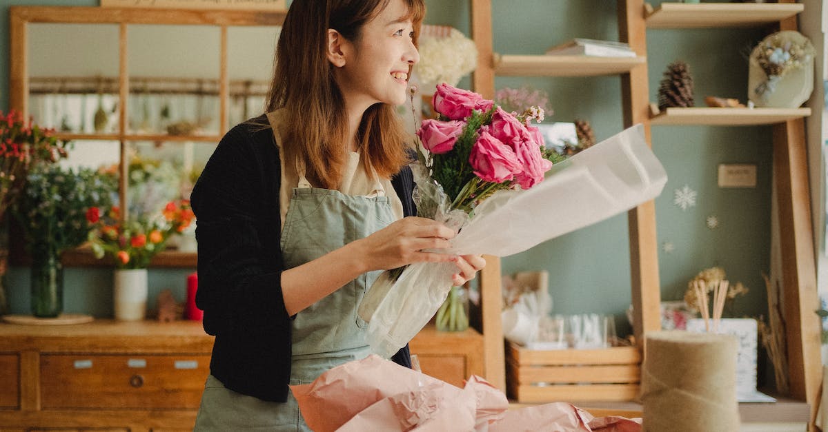 Is it possible to create a Villager who sells pufferfish? - Optimistic Asian female florist wearing apron making flower bouquet with roses while standing in floral workshop