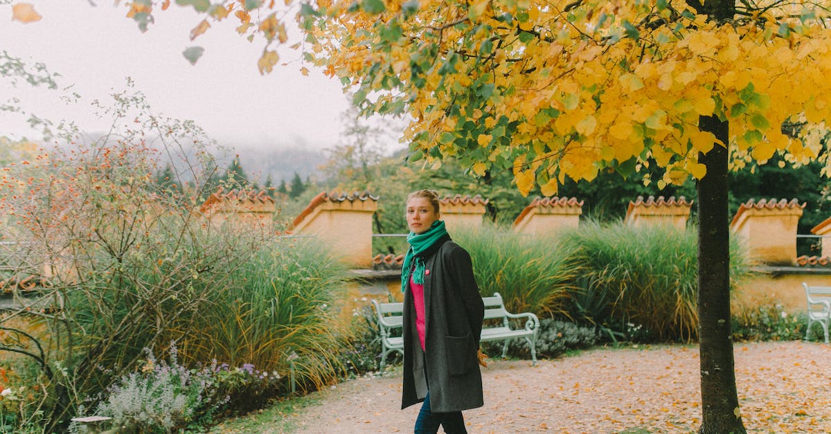 Is it possible to do The Pitt without a slave outfit? - Woman in Black Coat Standing on Pathway