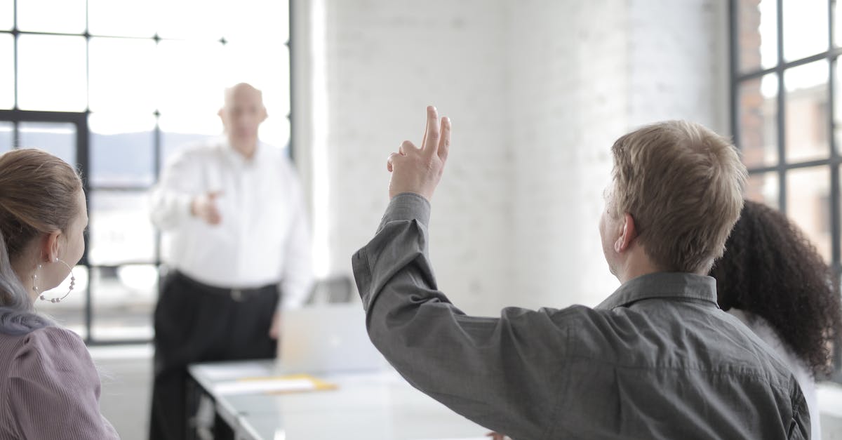 Is it possible to get boss souls back? - Male employee raising hand for asking question at conference in office boardroom Is it possible to get boss souls back? - Male employee raising hand for asking question at conference in office boardroom