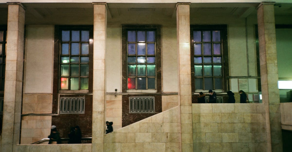 Is it possible to get dark elixir before Town Hall 7? - People walking downstairs on grand building entrance