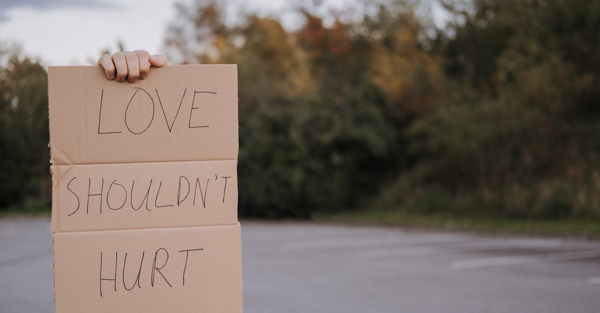 Is it possible to get infinite physical damage with the right cards in Paragon? - Crop anonymous person demonstrating carton signboard with slogan love should not hurt on blurred background of asphalt road and trees Is it possible to get infinite physical damage with the right cards in Paragon? - Crop anonymous person demonstrating carton signboard with slogan love should not hurt on blurred background of asphalt road and trees
