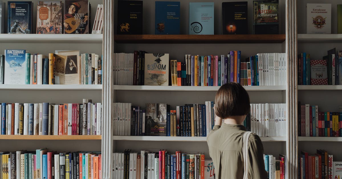 Is it possible to go back to the Slums after story finished? - Woman in Beige Long Sleeve Shirt Standing in Front of White Wooden Book Shelf Is it possible to go back to the Slums after story finished? - Woman in Beige Long Sleeve Shirt Standing in Front of White Wooden Book Shelf