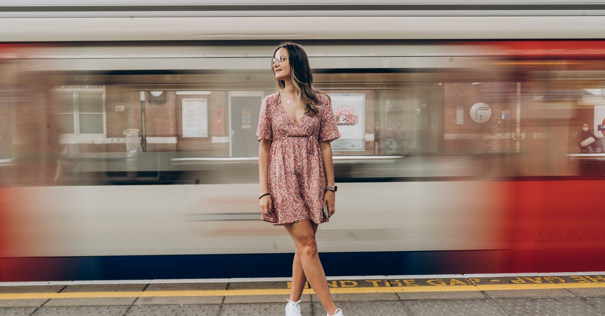 Is it possible to make a moving platform below a player's feet? - Woman Posing on Platform in Front of Train Driving By