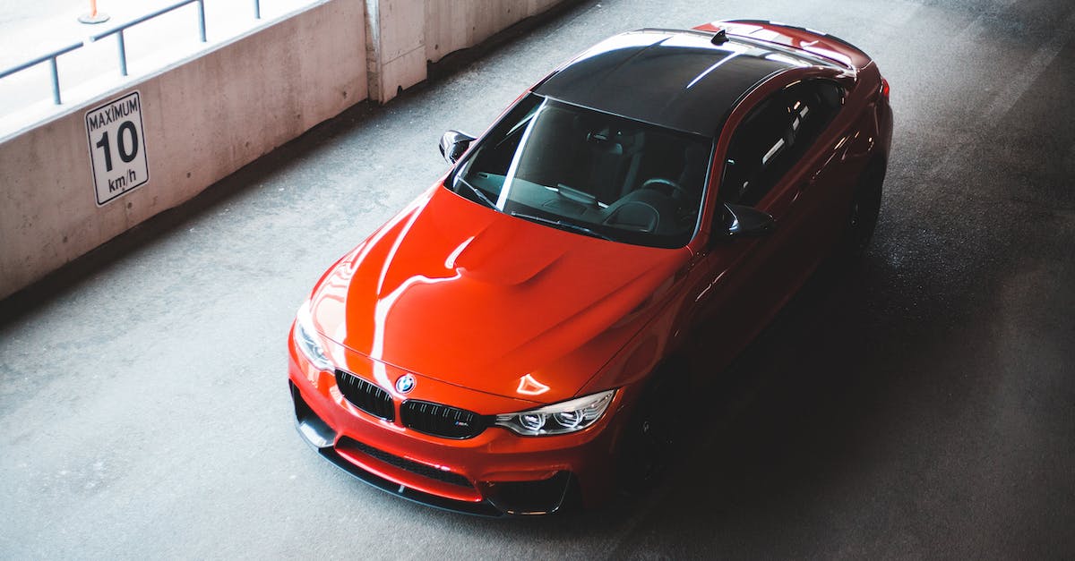 Is it possible to model real cities in the new Cities: Skyline? - From above of sport modern automobile with red and black elements on parking road