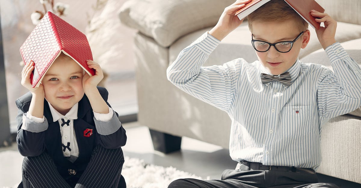 Is it possible to multiplayer Project Zomboid with only one copy of the game? - Smiling little students in formal clothes gathering on floor near sofa and playing games with textbooks while studying together at home