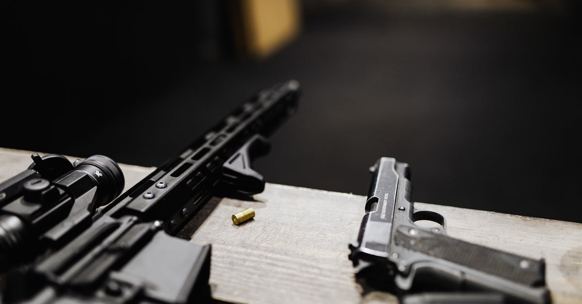 Is it possible to pick up secondary weapons in COD? - A Rifle and a Handgun on a Desk