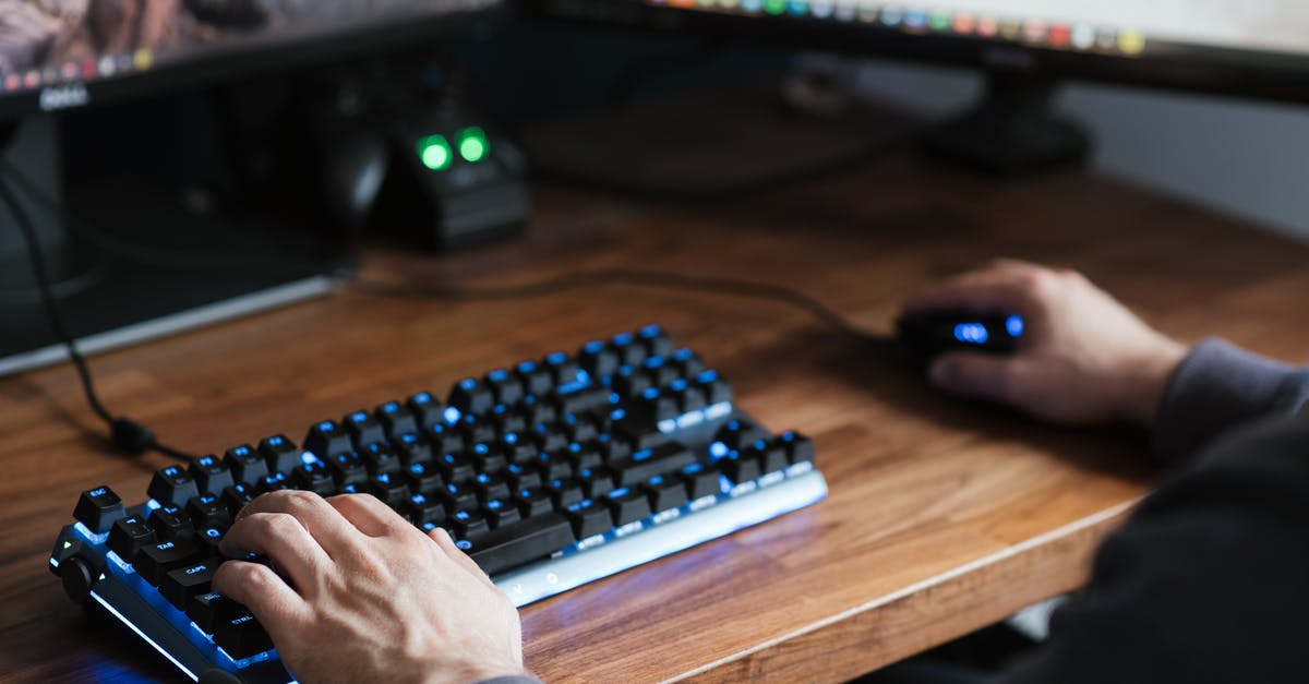 Is it possible to play Civ 6 or BE on a Secondary Monitor? - High angle crop male in casual clothes sitting at desk and browsing contemporary computer while typing on backlit keyboard and using mouse Is it possible to play Civ 6 or BE on a Secondary Monitor? - High angle crop male in casual clothes sitting at desk and browsing contemporary computer while typing on backlit keyboard and using mouse