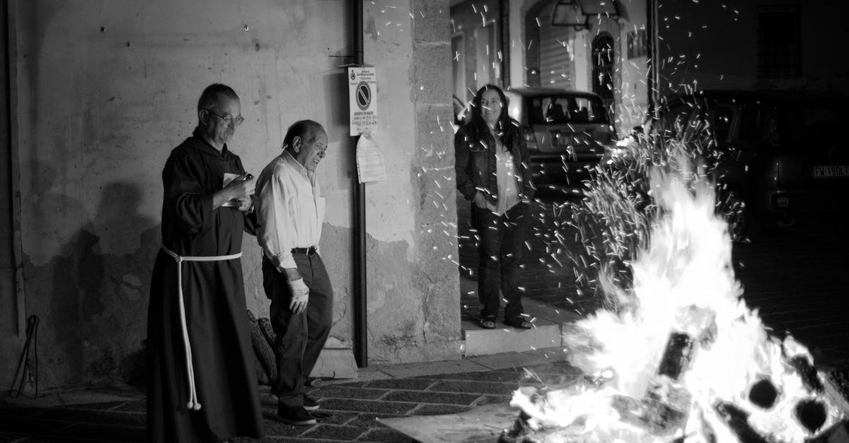 Is it possible to revive a priest in Orctown? - Man in White Robe Smoking Cigarette