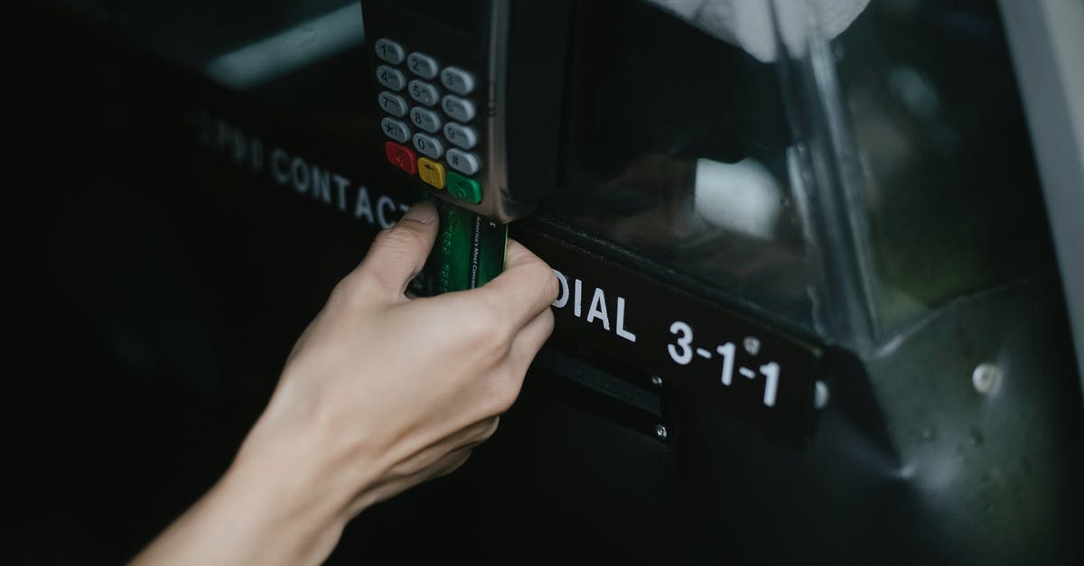 Is it possible to roll using the controller? - Crop anonymous traveler using card device while paying for taxi ride in automobile