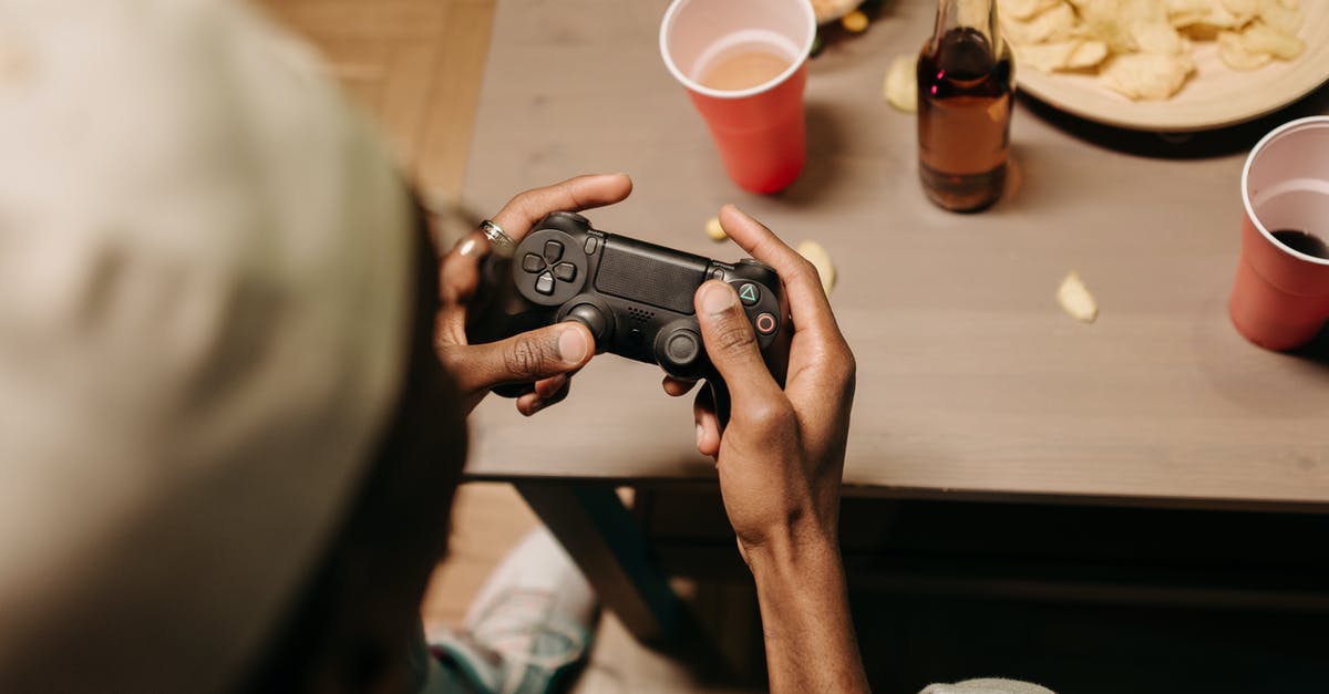 Is it possible to roll using the controller? - Person Holding Black Point and Shoot Camera