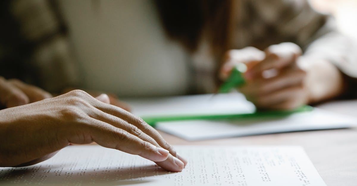 Is it possible to sense the depth of a well? - Photo of Person Touching the Surface of Braille